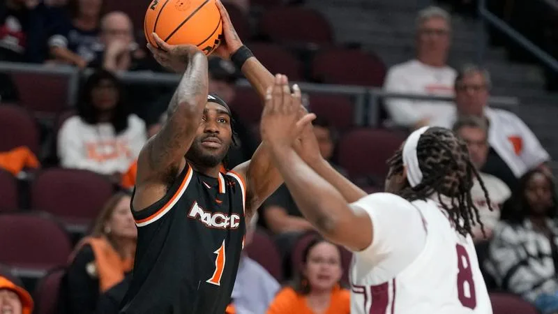 March 8, 2026; Las Vegas, NV, USA; Pacific Tigers guard Justin Rochelin (1) shoots the basketball against Santa Clara Broncos forward Elijah Mahi (8) during the second half of the WCC Basketball Championships at Orleans Arena.