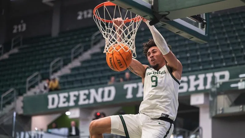 Viking basketball forward Isaac Brice dunks in a game during the 2024-25 season.