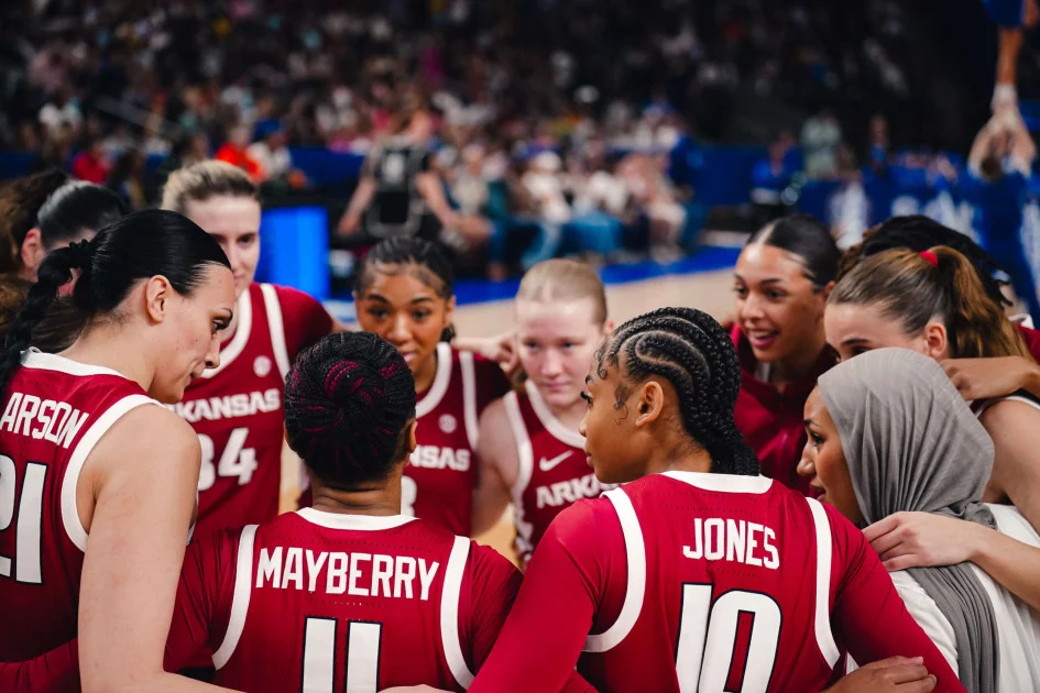 Arkansas women’s basketball players in a team huddle at the SEC Tournament