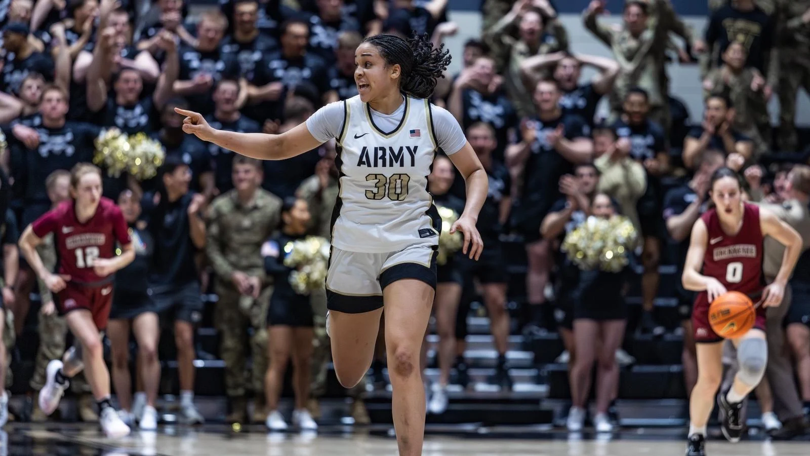 Kya Smith runs back to defensive end of court after making a basket