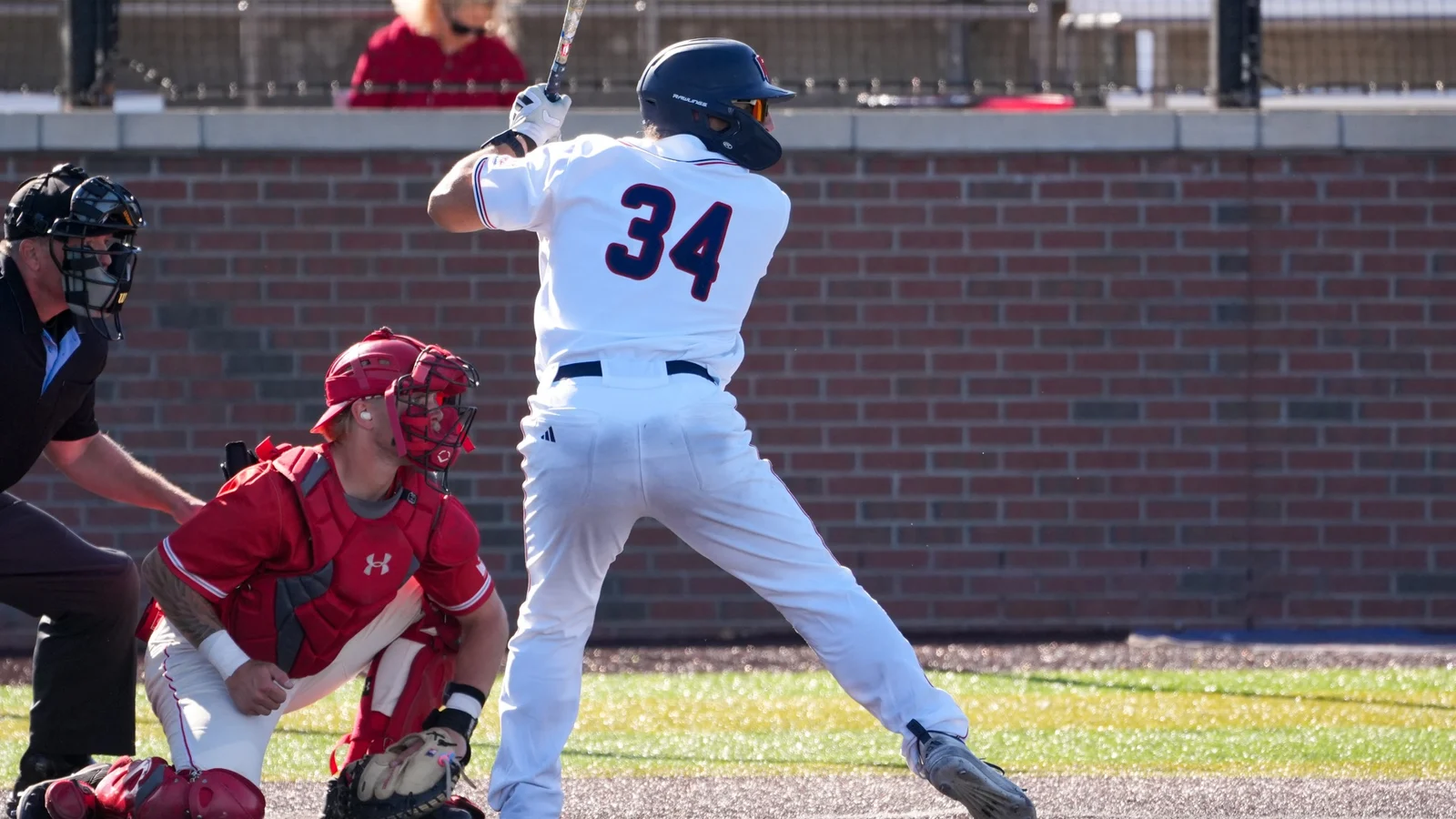 A Belmont baseball player bats against Bradley in a Bruins uniform