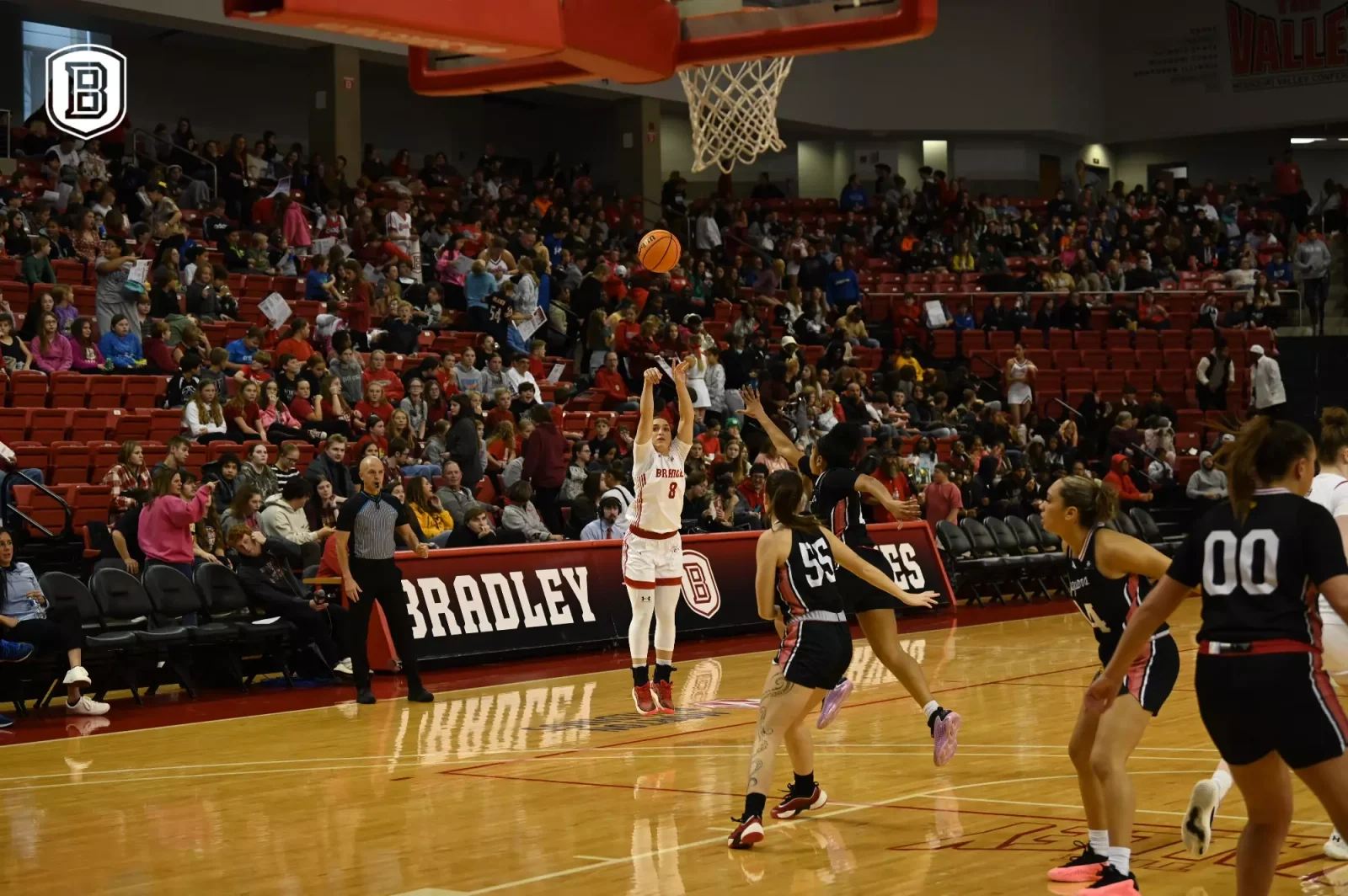 A Bradley women's basketball player shoots in a white Braves uniform against IU Indy