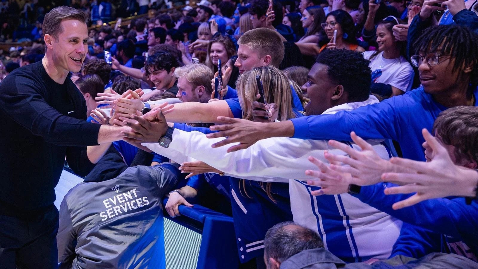 Duke men's basketball coach Jon Scheyer greets fans at Cameron Indoor Stadium