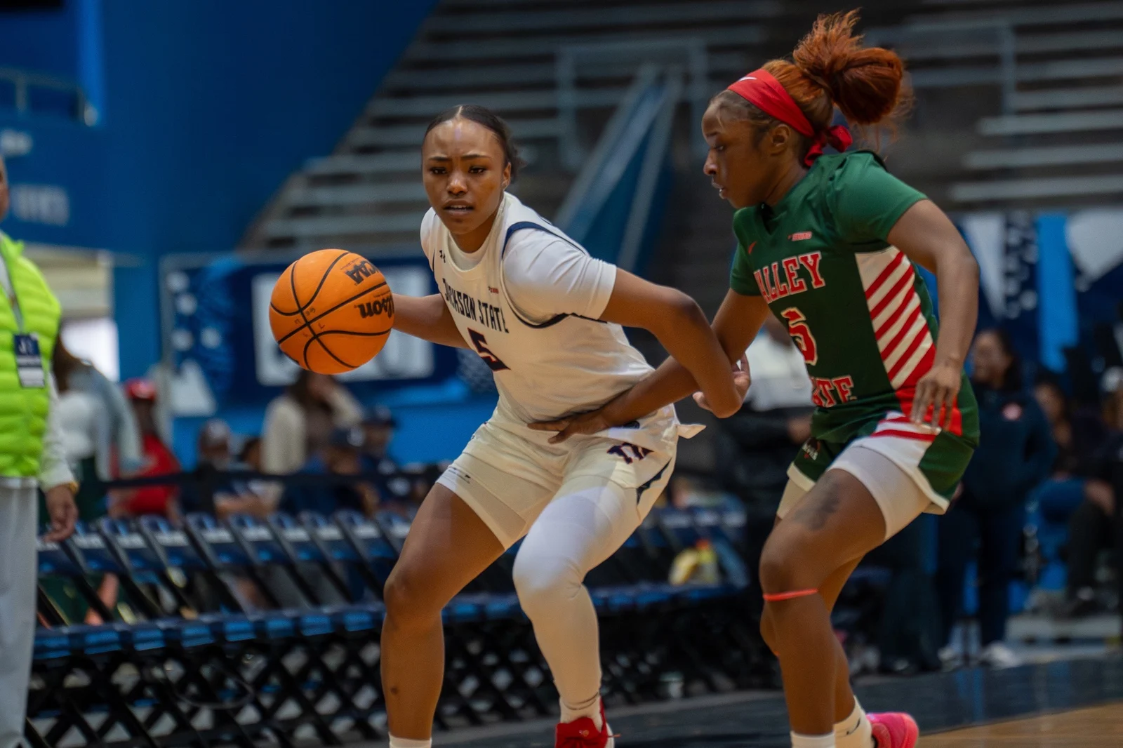 A Jackson State women's basketball player handles the ball against Mississippi Valley State