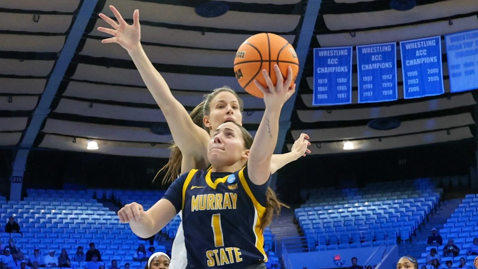 Murray State guard Halli Poock attempts a layup against Maryland in the NCAA Tournament