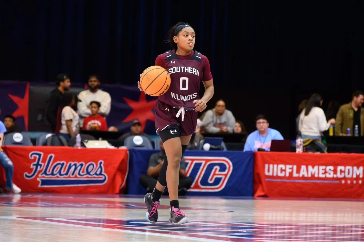 Southern Illinois guard Quierra Love brings the ball up court against UIC