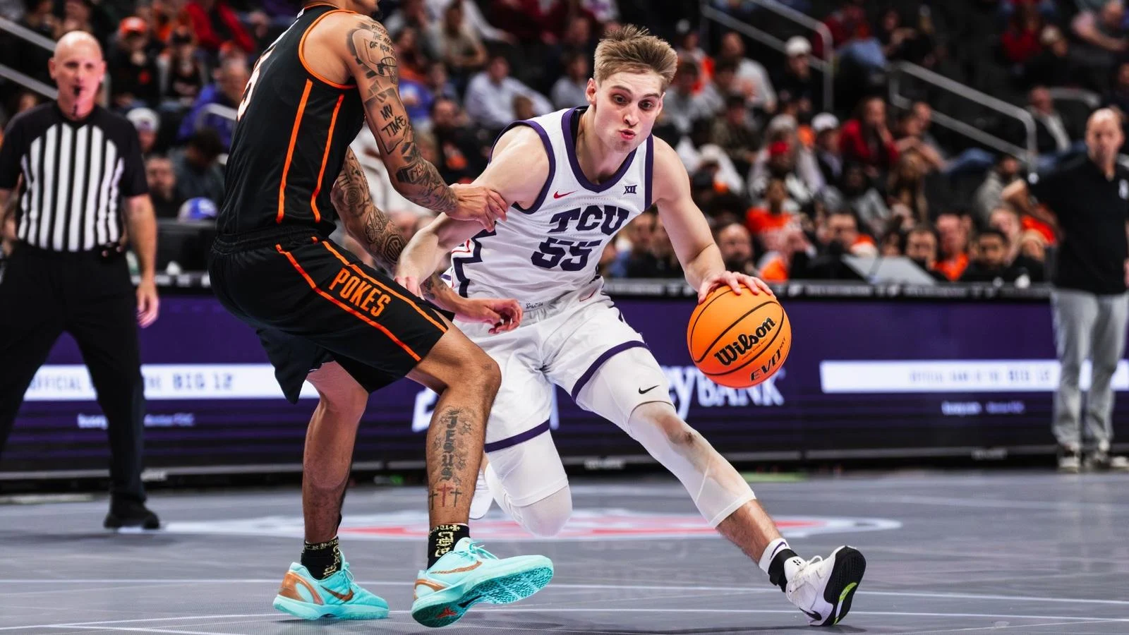 Tanner Toolson drives the ball against Oklahoma State