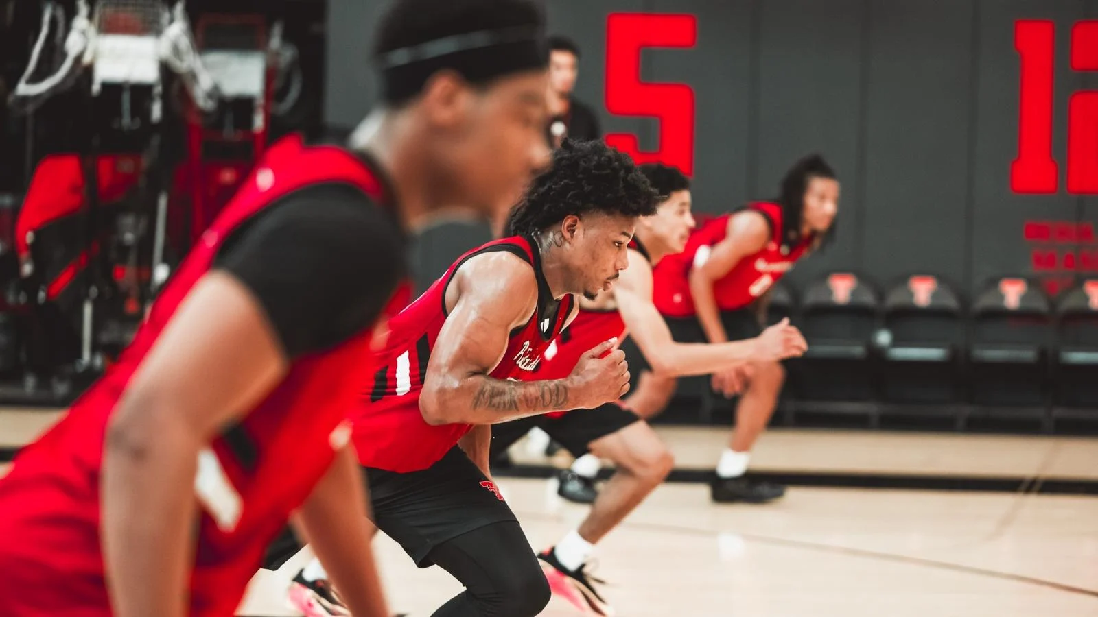 Jamichael Stillwell races down the court during a conditioning drill in an out of season practice.