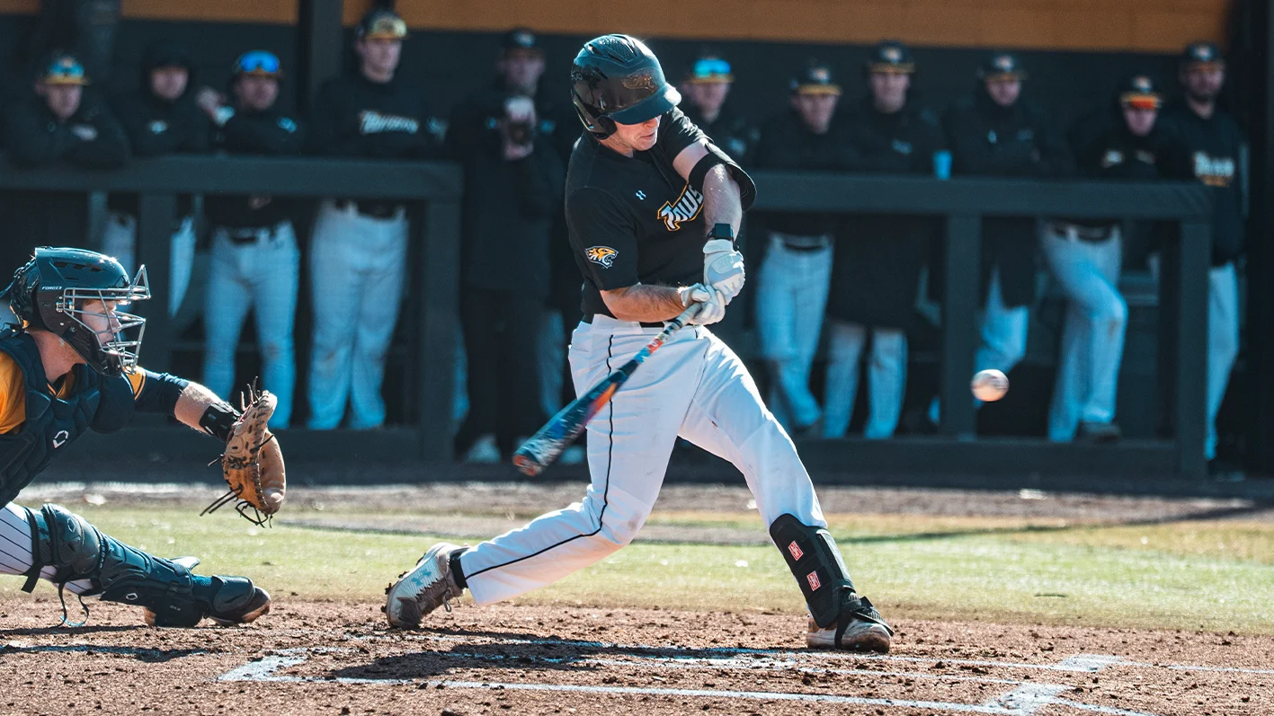 Towson baseball player Brian Heckelman throws in a Tigers uniform