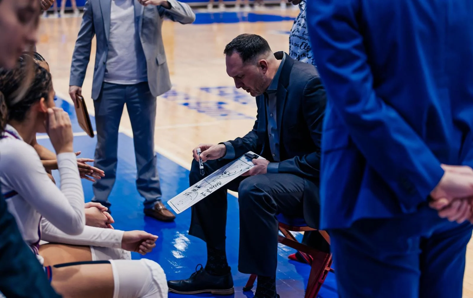 Jon Plefka drawing up a play during a timeouts